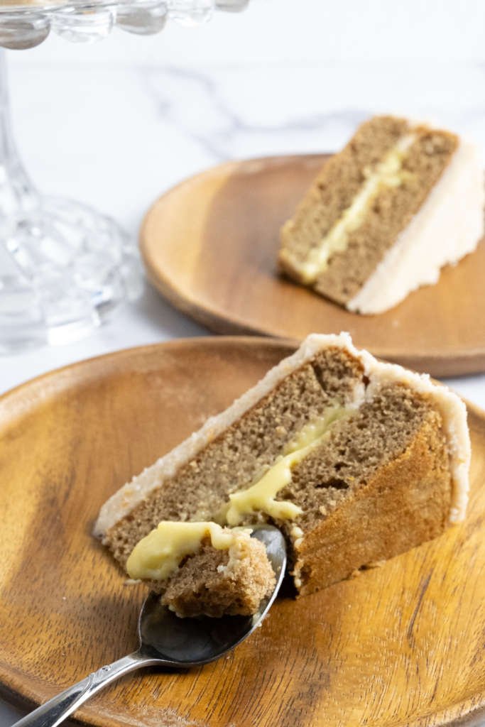 chai layer cake with orange curd and cinnamon buttercream frosting